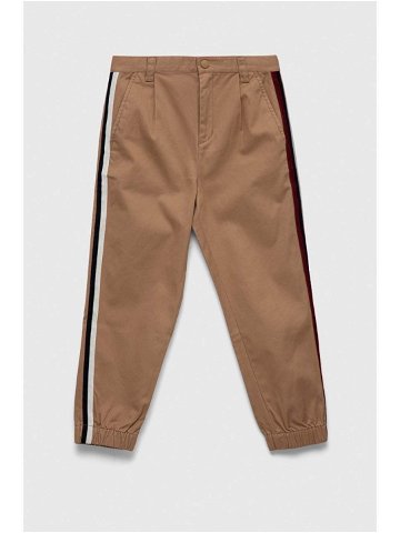 Dětské kalhoty Tommy Hilfiger béžová barva hladké