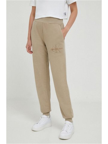 Bavlněné tepláky Calvin Klein Jeans béžová barva