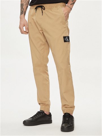Calvin Klein Jeans Joggers kalhoty Monologo Badge J30J325114 Béžová Skinny Fit