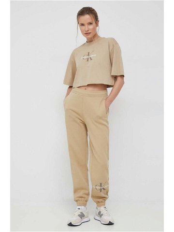 Tepláky Calvin Klein Jeans dámské béžová barva s potiskem