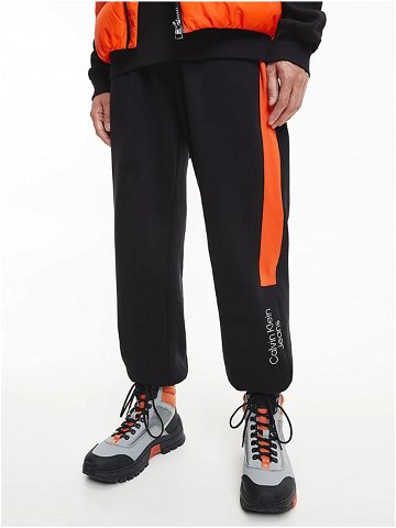 Oranžovo-černé pánské tepláky Calvin Klein Jeans