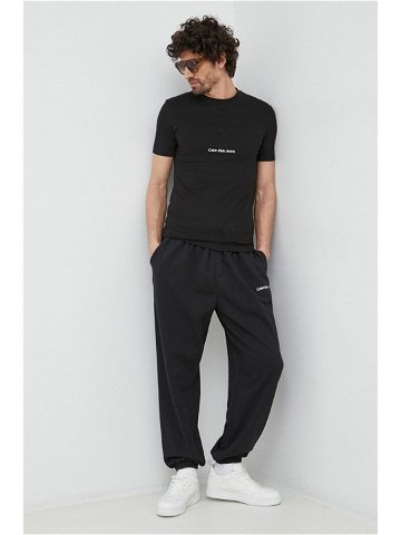 Tepláky Calvin Klein Jeans černá barva s aplikací